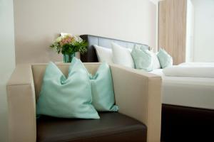 Ένα ή περισσότερα κρεβάτια σε δωμάτιο στο Hotel Claro Garni