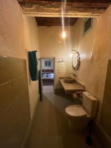 a bathroom with a toilet and a sink at Siwa Oracle Hostel in Siwa +53 photos