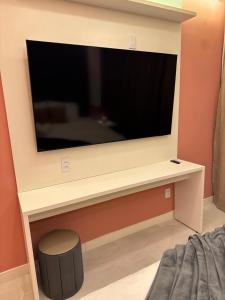 a flat screen tv on a wall in a room at Mahalo Exclusive Boutique in Maragogi