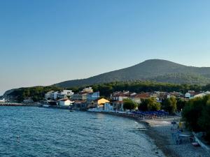 a town on the shore of a body of water at Ireon Seaside Breeze studio in Ireon