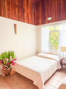 En eller flere senge i et værelse på Selva Partners La Fortuna