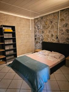 Giường trong phòng chung tại Bungalow Les Cocotiers