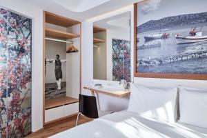 Postel nebo postele na pokoji v ubytování Olive Green Hotel