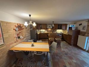 a kitchen and dining room with a table and chairs at Oliver's House in Budaörs