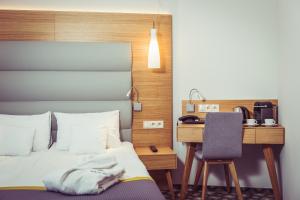 Postel nebo postele na pokoji v ubytování Hotel Vivaldi
