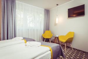 Postel nebo postele na pokoji v ubytování Hotel Vivaldi