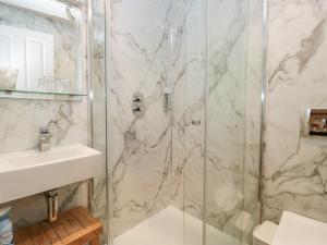 a bathroom with a shower and a sink at Norwood House in Ambleside +58 photos