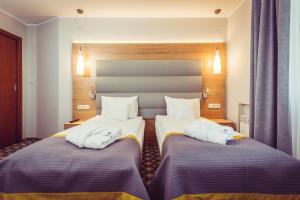 Postel nebo postele na pokoji v ubytování Hotel Vivaldi