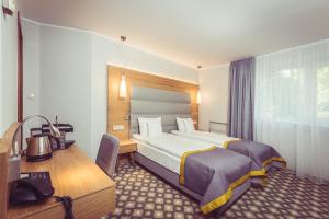 Postel nebo postele na pokoji v ubytování Hotel Vivaldi