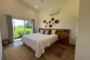 Postel nebo postele na pokoji v ubytování Triskele Retreat - Combo Ocean and Earth + 23 fotografií