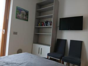 TV a/nebo společenská místnost v ubytování CASA VACANZE RELAX