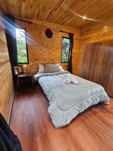 Postel nebo postele na pokoji v ubytování Cabaña Entre montañas La Calera