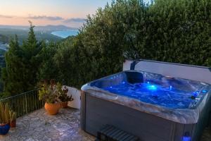 a jacuzzi tub sitting on top of a patio at CASA CHAGUIMAMA Begur in Begur