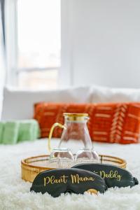 a glass jar sitting on a table with a black label at Jungle House Luxury Homes - Columbus Downtown Short North - Steps to Convention Center & Nationwide Arena - Sleeps up to 8 - Free Parking - Over 5,800 Five Stars in Columbus