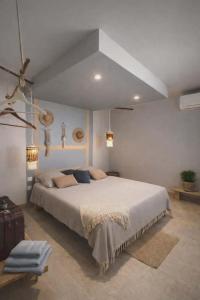 En eller flere senge i et værelse på Le temps d'un repos