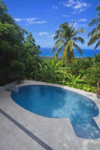 Swimmingpoolen hos eller tæt på Le temps d'un repos