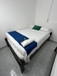 Giường trong phòng chung tại Hotel Geomar +3 ảnh