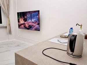 a computer monitor sitting on a desk in a room at Poznaj Mickiewicza 2 in Racibórz