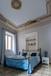 En eller flere senge i et værelse på Apt City Center Meraviglie Di Sicilia