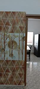 a room with a mural of a pond and trees at AI cube Homes in Pīrmed