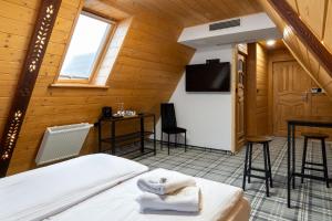 En eller flere senge i et værelse på Zapotoczny Residence