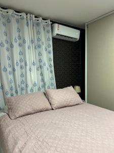 Postel nebo postele na pokoji v ubytování Fenix Dourado