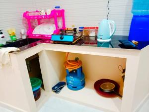a toy kitchen with a counter and a sink at Velu House - 2-Room Apartment in Jaffna