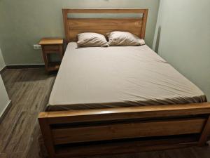 Postel nebo postele na pokoji v ubytování Blue Legend Tourist Residence