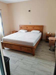 Postel nebo postele na pokoji v ubytování Blue Legend Tourist Residence + 5 fotografií