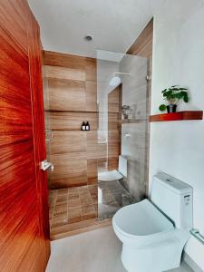 a bathroom with a toilet and a shower at OVATA 401- Zona Romántica in Puerto Vallarta