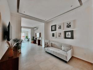 a living room with a couch and a table at OVATA 401- Zona Romántica in Puerto Vallarta