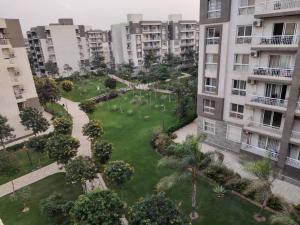 an aerial view of a park between two buildings at مدينتي in Kafr Salīm