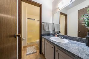 a bathroom with a sink and a mirror at Kingswood Pines in Kings Beach