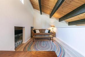 a living room with a couch and a fireplace at Kingswood Pines in Kings Beach