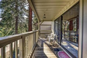 a porch of a house with a chair on it at Kingswood Pines in Kings Beach