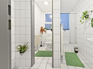 a bathroom with a toilet and a sink at AlbRooms Nürtingen Monteur & Business Privatzimmer in Nürtingen +45 photos