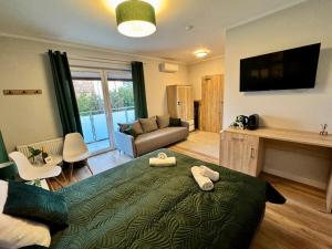 Postel nebo postele na pokoji v ubytování BALTICUS Mrzeżyno