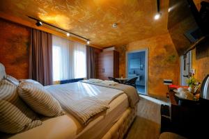a bedroom with a large bed in a room at Cappadocia Divin House in Göreme