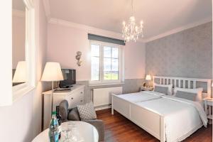 Giường trong phòng chung tại Hotel Villa Wahnfried Thiessow +269 ảnh