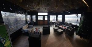 an overhead view of a living room with couches and chairs at Boletov Raj in Čurug