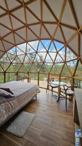 Ένα ή περισσότερα κρεβάτια σε δωμάτιο στο Glamping Reserva del Dorado +73 φωτογραφίες