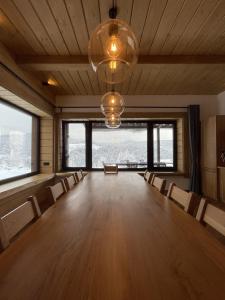 a large room with chairs and a large room with windows at Шале 5 Стефанія in Mykulychyn +72 photos