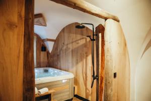a bathroom with a sink and a wooden wall at Chalet du cerf fragment in Saint-Martin-de-Belleville +58 photos