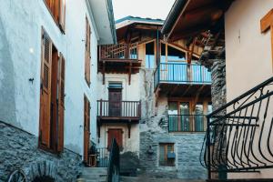 a group of buildings with stairs and balconies at Chalet du cerf fragment in Saint-Martin-de-Belleville