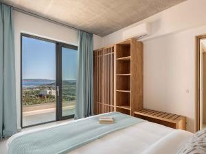 Postel nebo postele na pokoji v ubytování Himmel Villas - Seaview luxury & private pools + 72 fotografií