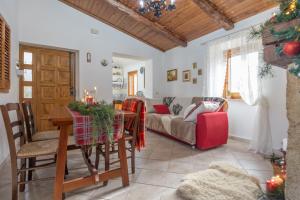 a living room with a table and a couch at Rustic Italian House in Roccamorice