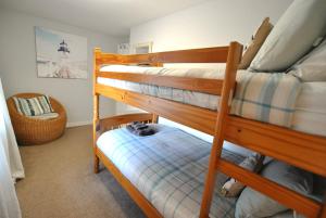 Postel nebo postele na pokoji v ubytování Sandpiper Cottage- Coastal hideaway