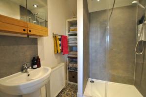 a bathroom with a sink and a shower at Mill View Cottage- charming coastal cottage in Saint Monance +39 photos