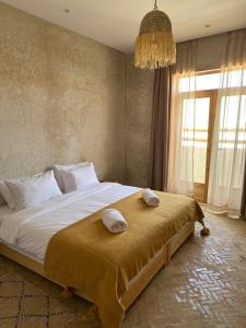 Postel nebo postele na pokoji v ubytování Numidia Surf House