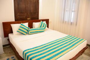 En eller flere senge i et værelse på Galle My Bungalow + 103 billeder